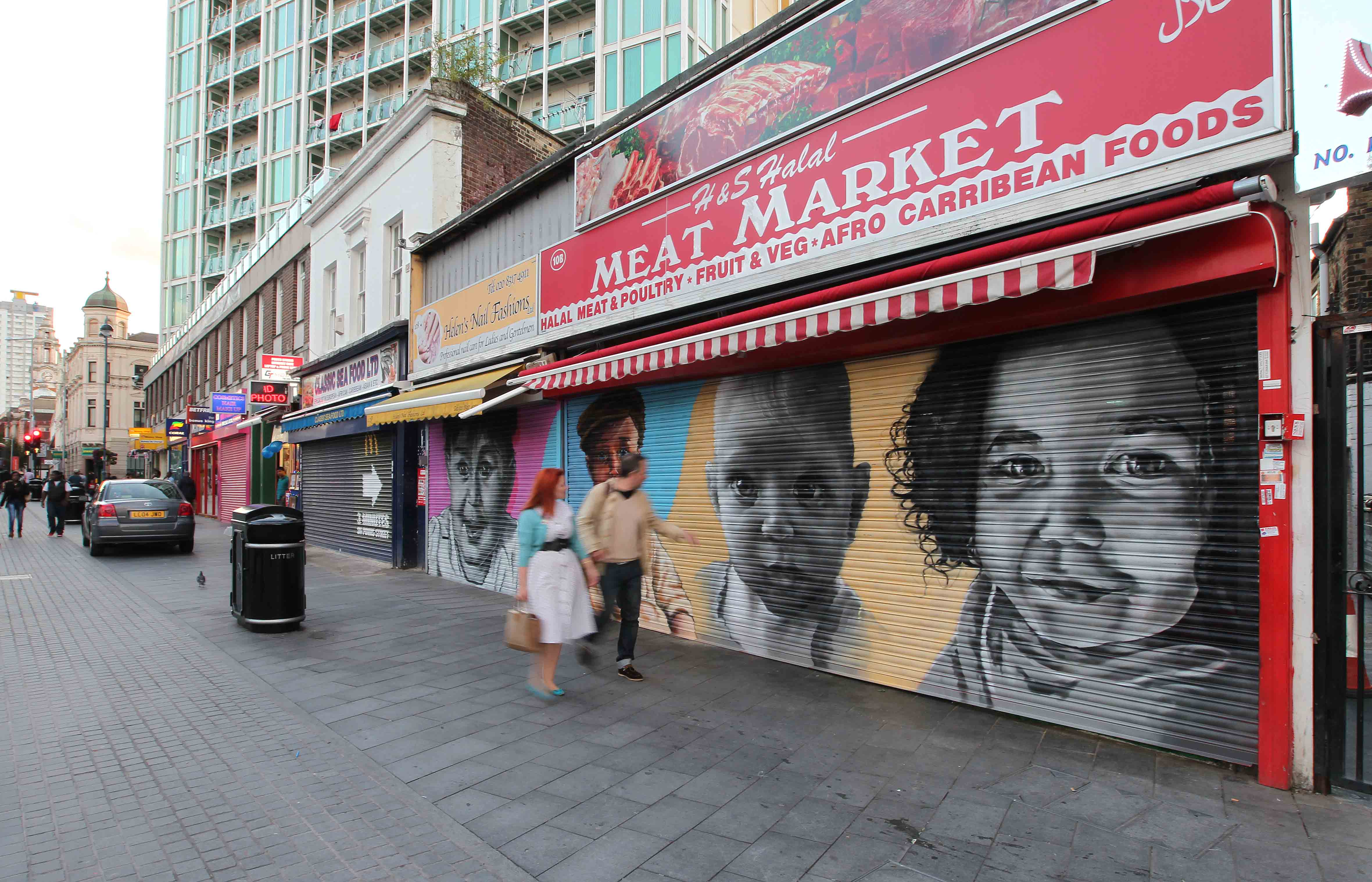 London shops with paintings of babies on the shutters